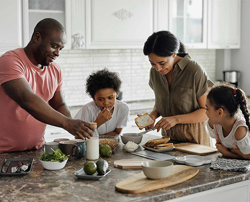 Family members making a healthy lunch together